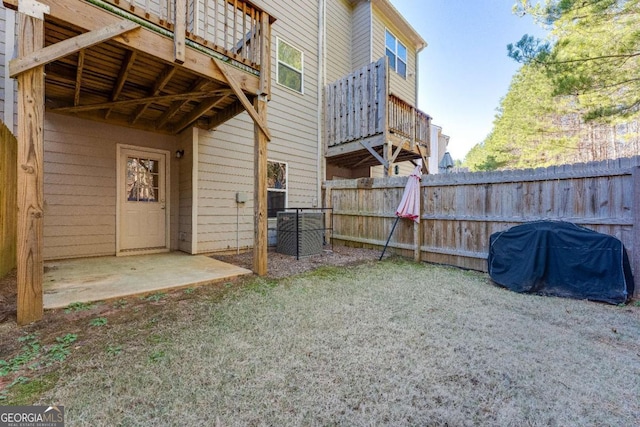 view of yard featuring fence and a patio