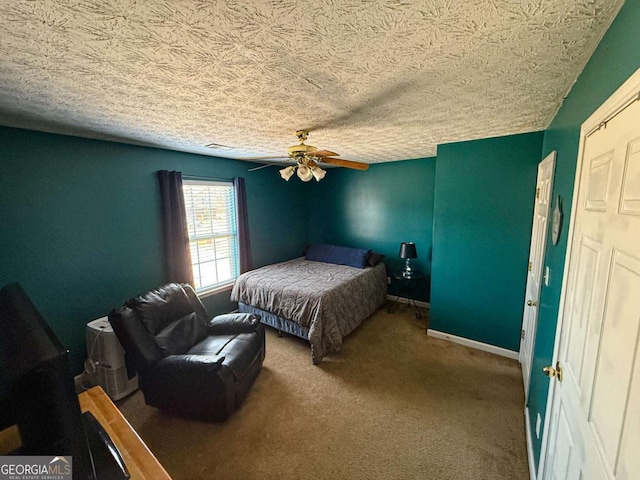 bedroom with visible vents, carpet flooring, ceiling fan, a textured ceiling, and baseboards