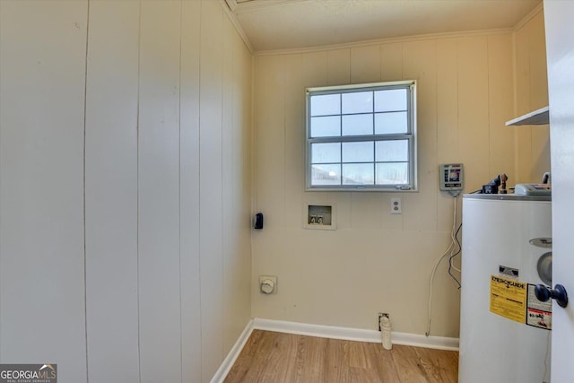 washroom featuring hookup for a washing machine, water heater, light wood-style flooring, ornamental molding, and laundry area