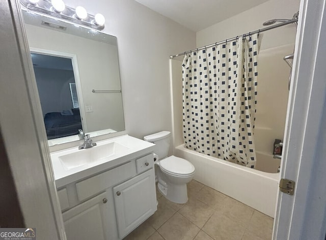 full bath with visible vents, shower / bathtub combination with curtain, toilet, vanity, and tile patterned flooring