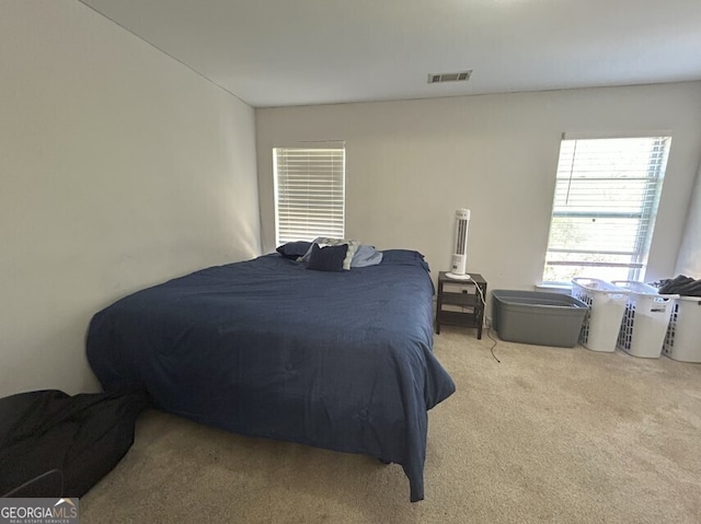 bedroom with carpet flooring and visible vents