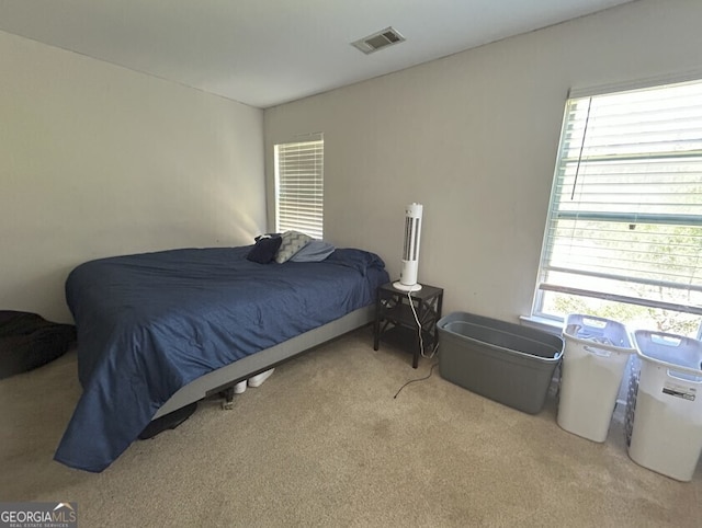 bedroom featuring carpet and visible vents