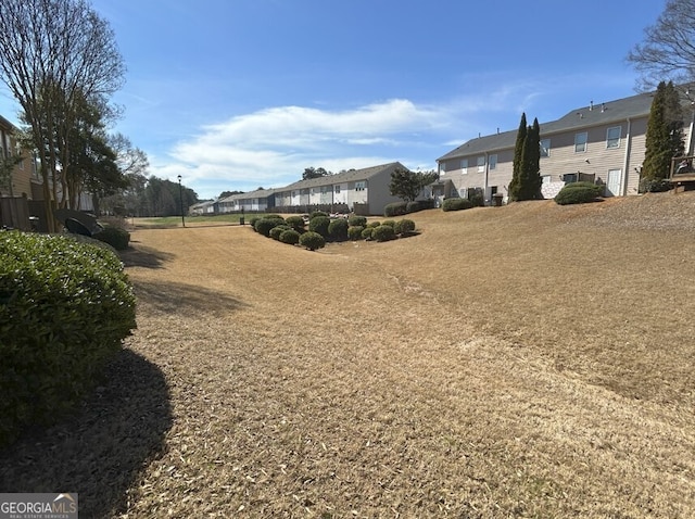 view of yard featuring a residential view