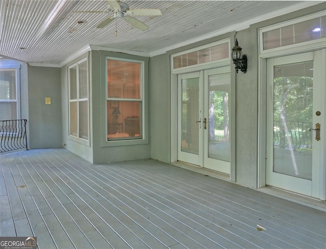 wooden deck featuring ceiling fan