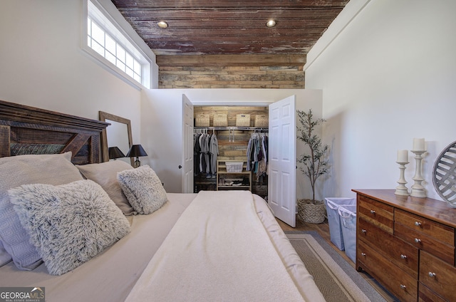 bedroom featuring recessed lighting, a closet, and wood ceiling