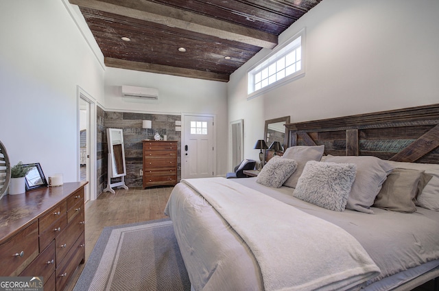 bedroom with wood finished floors, beam ceiling, a high ceiling, a wall mounted air conditioner, and wooden ceiling