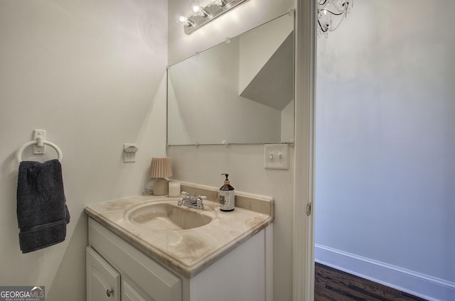 bathroom with baseboards and vanity