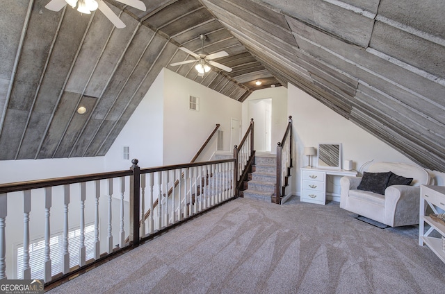 additional living space with visible vents, lofted ceiling, carpet, and ceiling fan