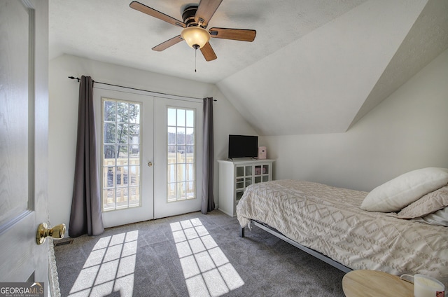 bedroom with access to exterior, carpet flooring, french doors, and vaulted ceiling