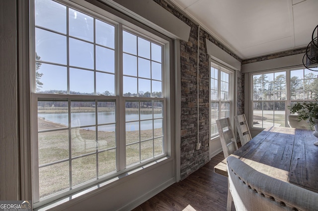 sunroom with a water view