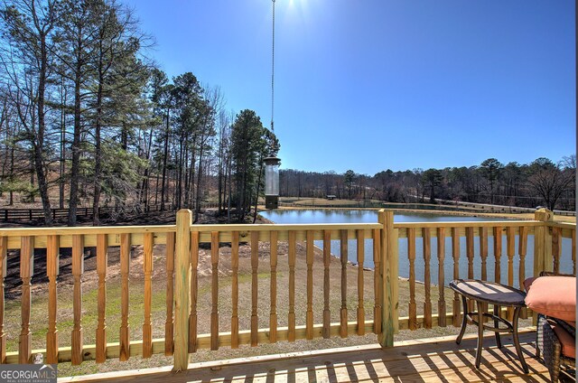 wooden terrace with a water view