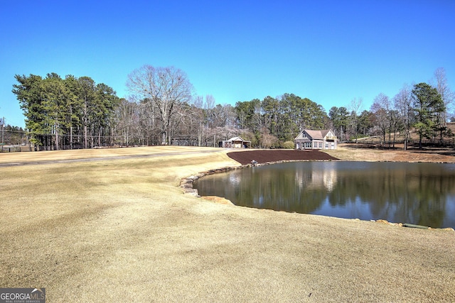 view of water feature with fence