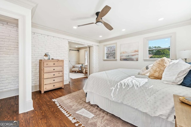 bedroom featuring a ceiling fan, brick wall, ornamental molding, wood finished floors, and recessed lighting