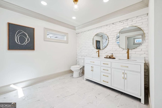 full bathroom featuring double vanity, marble finish floor, ornamental molding, and toilet