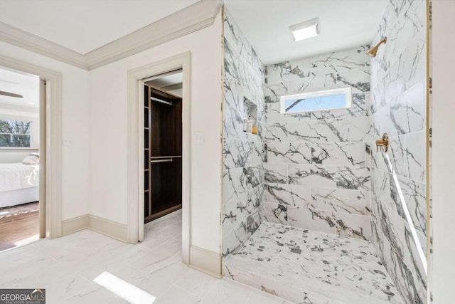 bathroom with marble finish floor, a marble finish shower, ensuite bathroom, ornamental molding, and baseboards