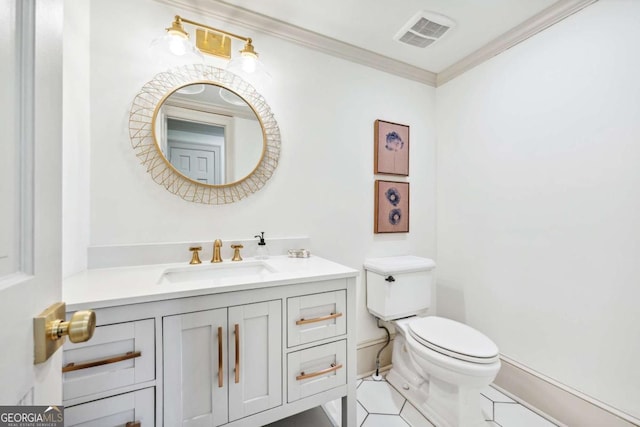 bathroom featuring toilet, vanity, visible vents, ornamental molding, and tile patterned floors