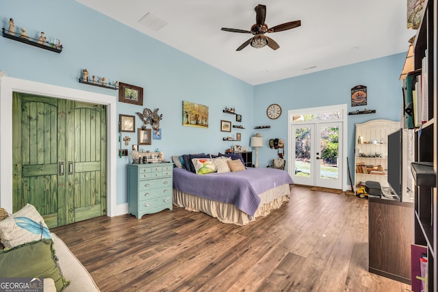 bedroom featuring dark wood-type flooring, visible vents, a ceiling fan, access to outside, and french doors