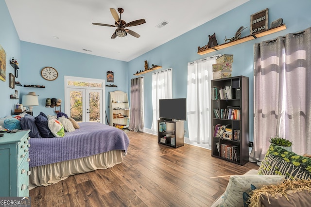 bedroom with access to exterior, french doors, visible vents, and hardwood / wood-style floors