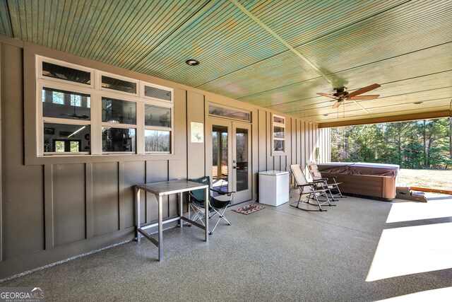 view of patio / terrace with a ceiling fan, french doors, and a hot tub