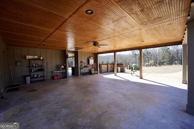 interior space with wood ceiling and a ceiling fan