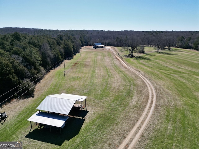 bird's eye view featuring a rural view and a view of trees