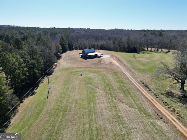 bird's eye view featuring a rural view and a wooded view