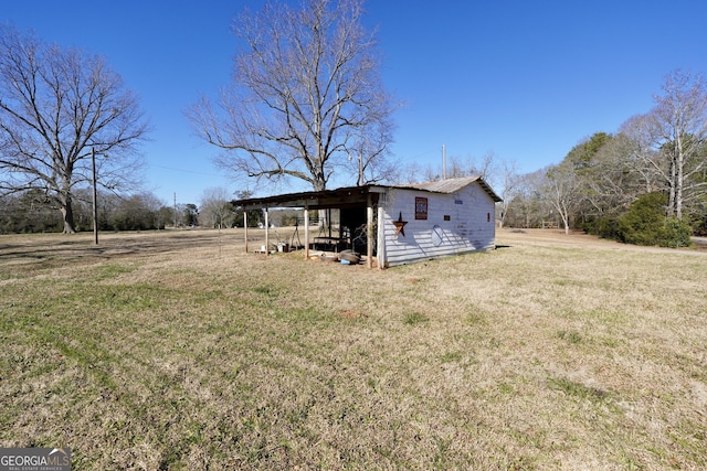 exterior space with an outbuilding and a front yard