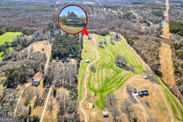 aerial view with a wooded view