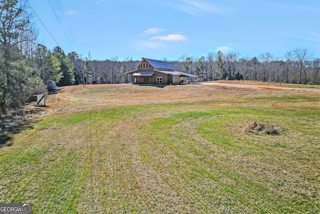 view of yard with a forest view