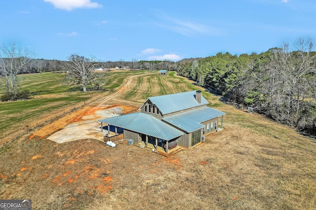 birds eye view of property with a rural view