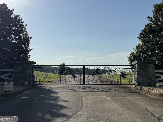 view of gate with fence