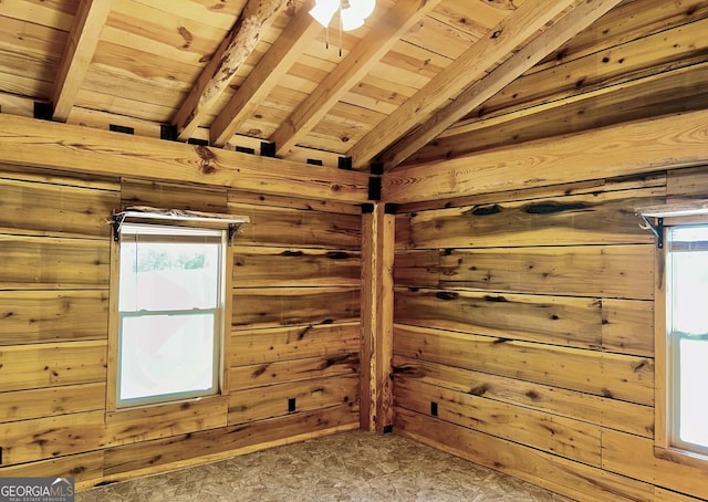 bonus room featuring wooden ceiling, carpet flooring, wooden walls, and lofted ceiling with beams