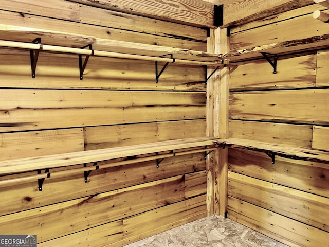 room details featuring a sauna and wooden walls