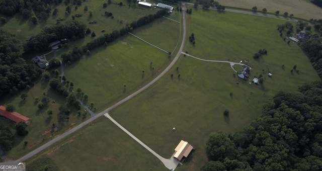 birds eye view of property with a rural view