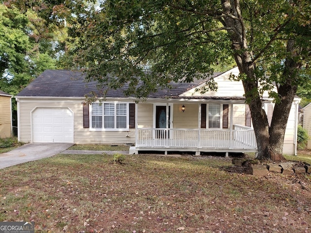 ranch-style home with a front lawn, driveway, a porch, roof with shingles, and a garage