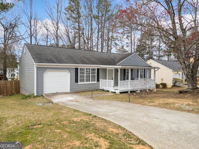 ranch-style home with fence, covered porch, concrete driveway, a front lawn, and a garage