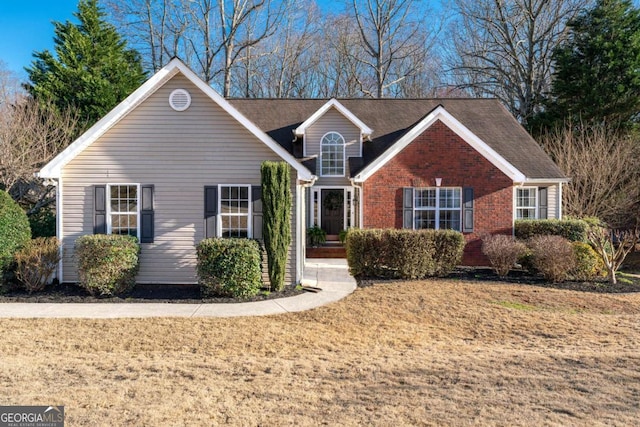 traditional home featuring brick siding