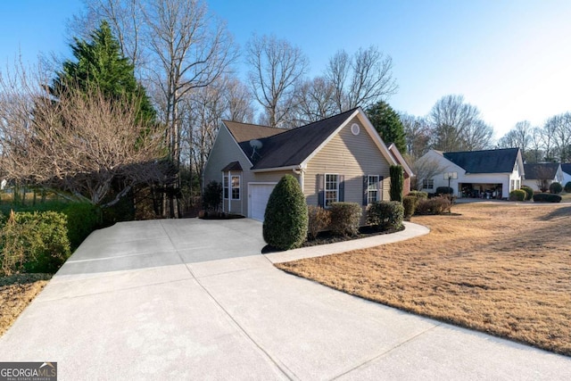 view of home's exterior featuring a garage and concrete driveway