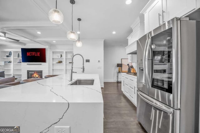 2850 Stonehall Ct SE, Smyrna, GA 30339 - kitchen with open floor plan, white cabinets, a sink, and stainless steel refrigerator with ice dispenser
