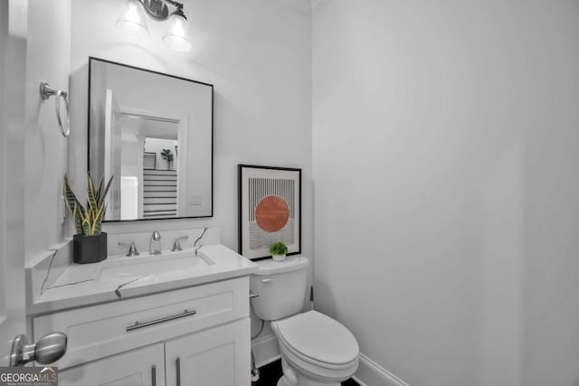 2850 Stonehall Ct SE, Smyrna, GA 30339 - bathroom with baseboards, vanity, and toilet