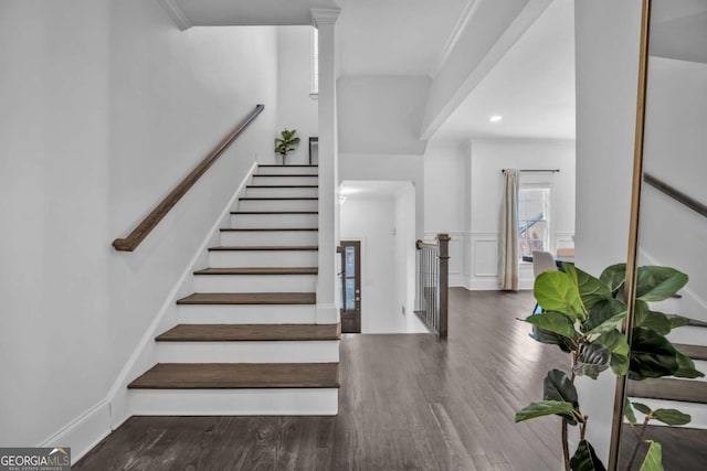 2850 Stonehall Ct SE, Smyrna, GA 30339 - stairs featuring a wainscoted wall, wood finished floors, and a decorative wall