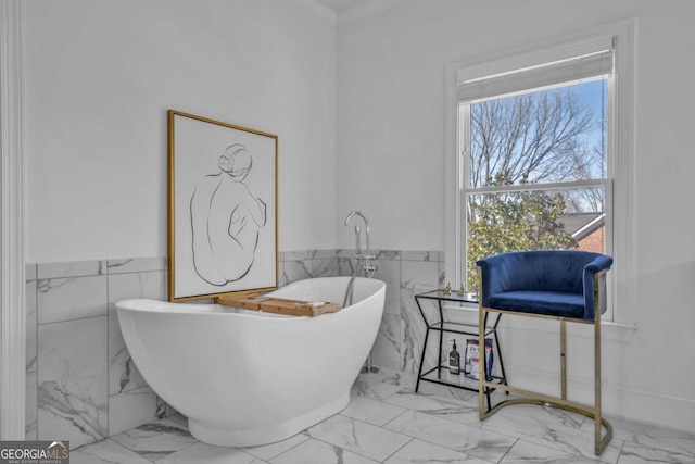 2850 Stonehall Ct SE, Smyrna, GA 30339 - full bathroom featuring a wainscoted wall, marble finish floor, plenty of natural light, and a freestanding tub