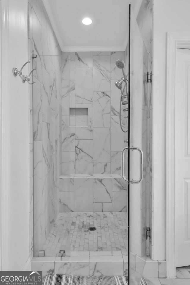 2850 Stonehall Ct SE, Smyrna, GA 30339 - bathroom featuring a marble finish shower and ornamental molding