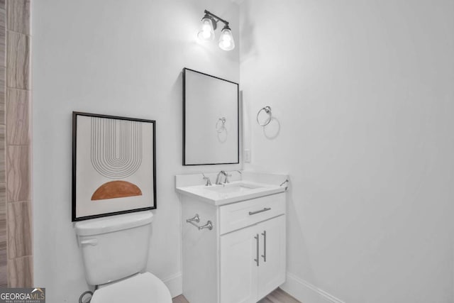 2850 Stonehall Ct SE, Smyrna, GA 30339 - full bathroom featuring toilet, vanity, and baseboards