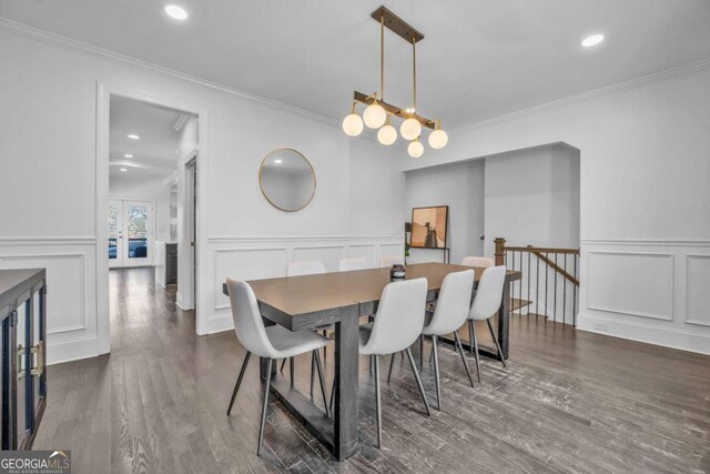 2850 Stonehall Ct SE, Smyrna, GA 30339 - dining space featuring ornamental molding, a decorative wall, dark wood-style flooring, and recessed lighting