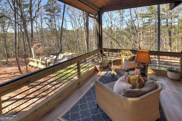 wooden deck featuring a wooded view