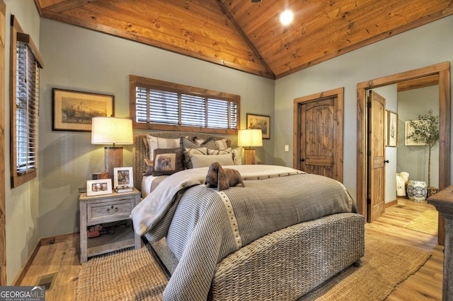 bedroom with light wood finished floors, baseboards, visible vents, wooden ceiling, and high vaulted ceiling