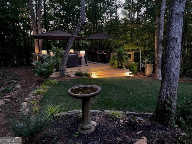 view of yard with a wooden deck