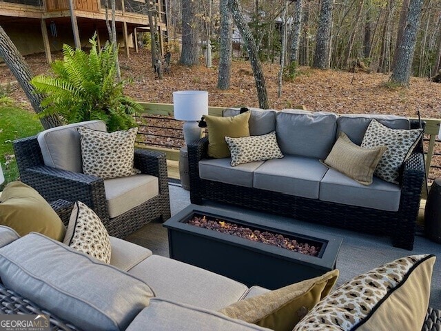 view of patio / terrace featuring an outdoor living space with a fire pit