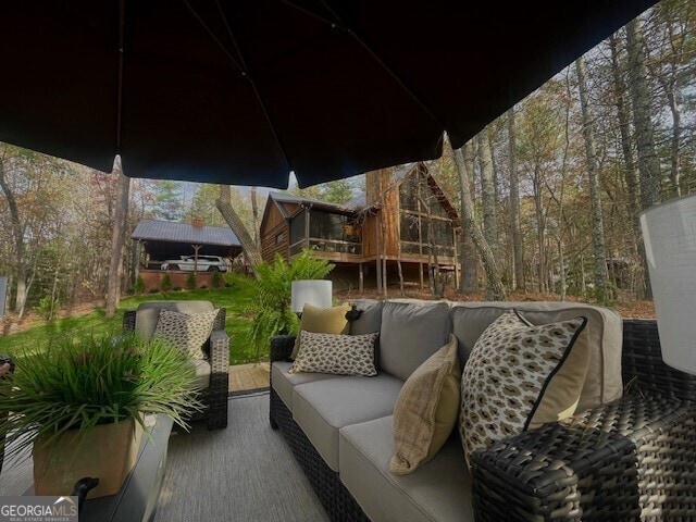 wooden deck with an outdoor hangout area